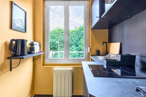 Kuchyň nebo kuchyňský kout v ubytování La Luxury - HyperCentre - Baignoire confort - Ambiance 5 étoiles