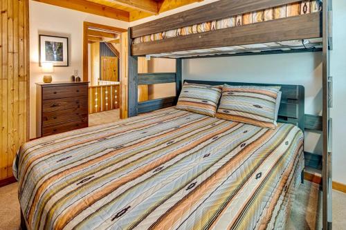 a bedroom with a bunk bed in a cabin at Juniper & Pine, a Lodge-Style Cabin in Sisters, OR in Sisters