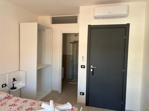 Ένα ή περισσότερα κρεβάτια σε δωμάτιο στο Guest House Pesce Celeste