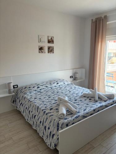 Ένα ή περισσότερα κρεβάτια σε δωμάτιο στο Guest House Pesce Celeste