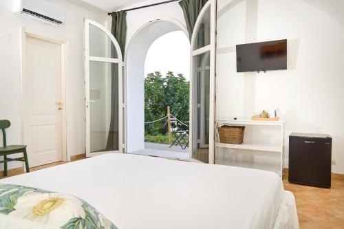 Ένα ή περισσότερα κρεβάτια σε δωμάτιο στο Villa Eudesandra