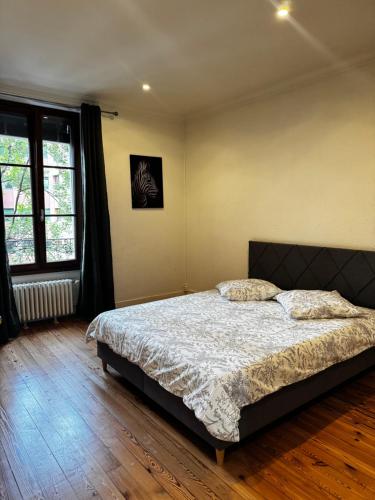 Postel nebo postele na pokoji v ubytování Grand 5 pièces au Centre Genève