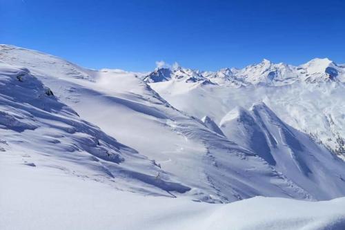 a view of a snow covered mountain range at Isabella 2 by SMR Rauris Apartments - inc Spa and near Gondola in Rauris