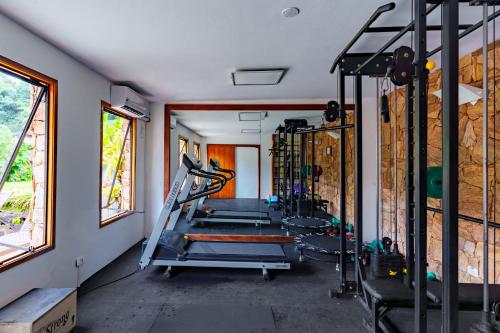 a gym with several tread machines in a room at Parador Lumiar Boutique Hotel & Spa in Lumiar