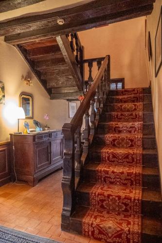 a stairway in a home with a wooden ceiling at Le Relais Cicero in La Flèche
