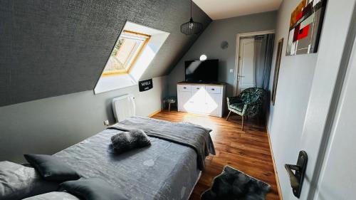 a small bedroom with a bed and a window at La Régence Ch 2 in Brette-les-Pins