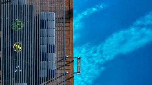 a view of two tall buildings with a blue sky at The Dynasty Villas in Sivota