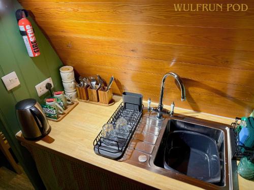 a kitchen counter top with a sink and a sink at West Stow Pods in Bury St Edmunds in West Stow