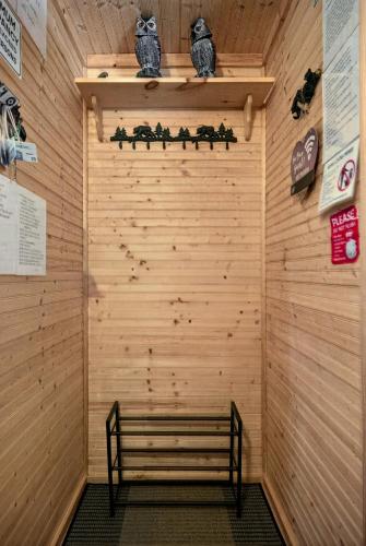 a sauna with a bench in a wooden wall at Hideout Pocono Chalet in Lake Ariel