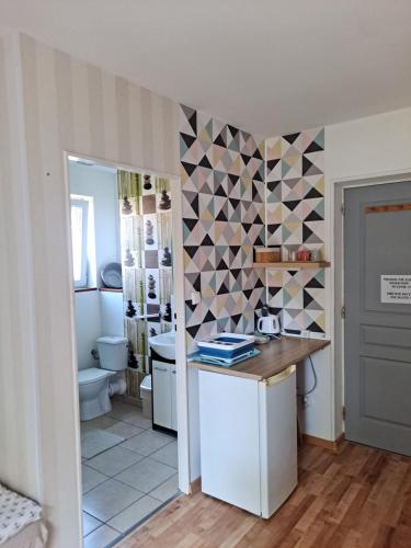 a bathroom with a sink and a toilet at Pokoje gościnne Keja in Wisełka