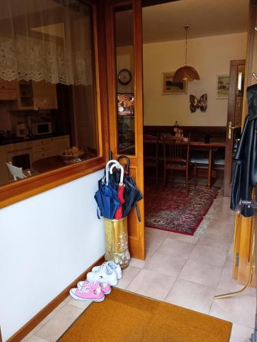 a room with a counter with umbrellas on the floor at Casa Francesco in Peaio