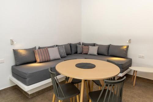 a living room with a couch and a table at Green Dream in Tinos Town