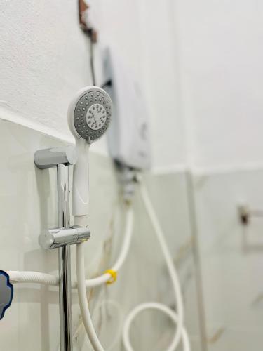 a blow dryer in a bathroom with a shower at Eastern Bay in Arugam Bay