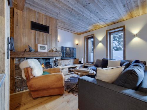 Superbe duplex 68m² avec cheminée, 2 chambres, parking intérieur, et services inclus à Val d'Isère