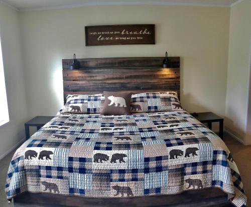 a bedroom with a bed with a quilt on it at Hidden meadow in Pullman