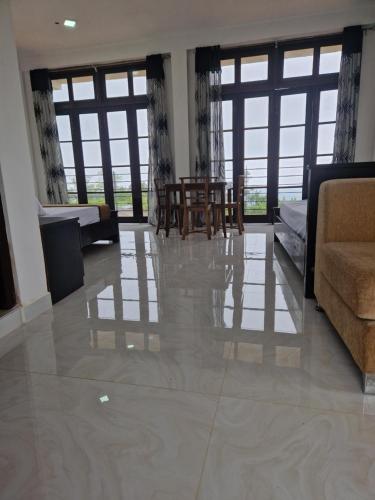 a living room with a couch and a table at Aruni Villa - Knuckles Range 