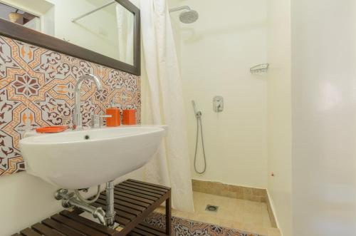 a bathroom with a sink and a shower at Villa dei Sogni in Vulcano