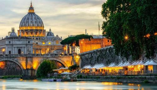 a view of a bridge and a building with a dome at Have a nice stay in Rome 2 in Rome