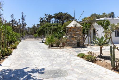 a stone walkway in front of a house at Green Dream in Tinos Town