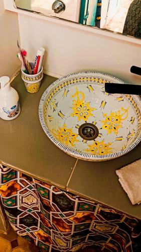 a counter with a sink on a table at Riad SULTANA lateral seaview in Saidia 