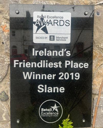 a sign on a wall that reads irelands fireballiest place winner winner at Forest Hills Lodge in Slane