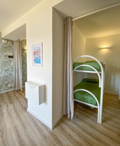 a bedroom with a bunk bed in a room at Residence Intur in Marciana Marina