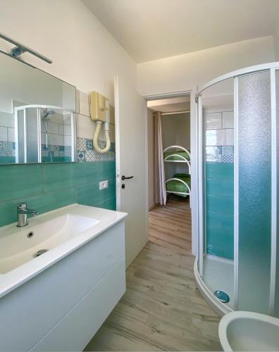 a bathroom with a sink and a shower at Residence Intur in Marciana Marina