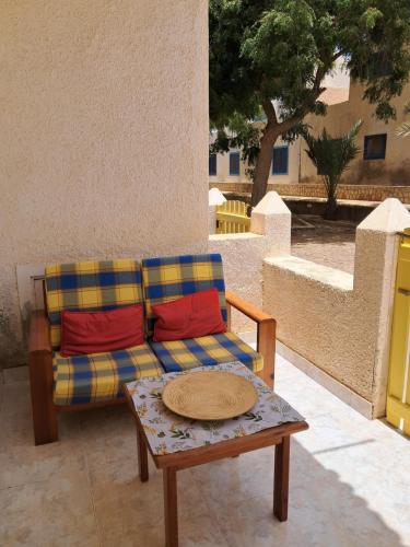 a couch and a coffee table on a patio at Vivenda Mia in Beirona