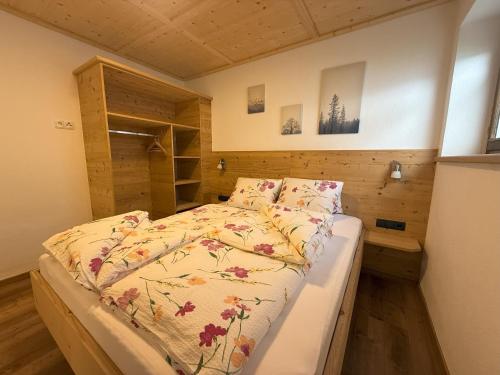 a bedroom with a bed in a small room at Ferienhaus Innergruben in Laimach