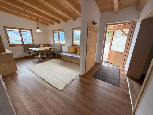 a living room with a table and a dining room at Ferienhaus Innergruben in Laimach