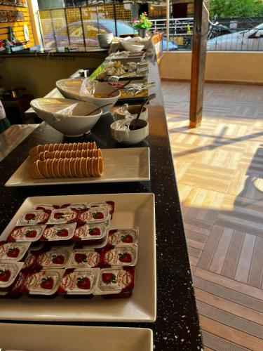 a buffet line with sushi and other food items at Metropolitan apart in Marmaris