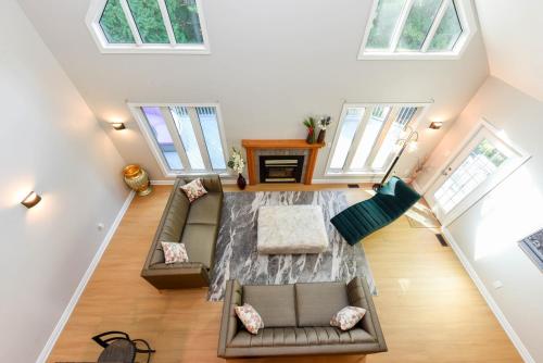 an overhead view of a living room with a couch and windows at Elegant 6 Bedroom Modern Retreat in Caledon in Inglewood