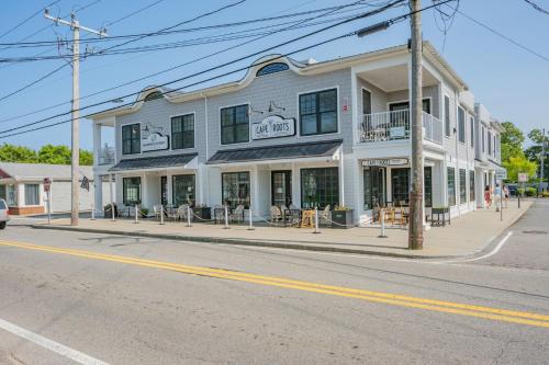 a building on the corner of a street at 557 Route 28, Unit 203, Harwich Port Cape Cod - - Perfect Rx in Harwich Port