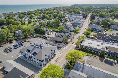 an aerial view of a town with a street at 557 Route 28, Unit 203, Harwich Port Cape Cod - - Perfect Rx in Harwich Port