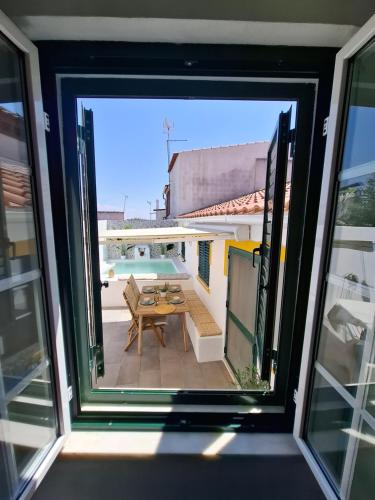 a view from a window of a patio with a table at Title e Title - Alentejo in Monforte