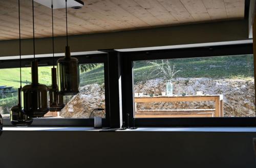 a room with a window with a view of a yard at La loge de la Dolarde in Prémanon
