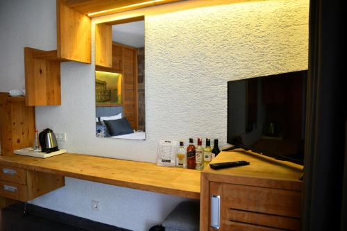 A kitchen or kitchenette at MyElla Boutique Hotel