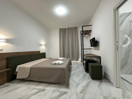 Ένα ή περισσότερα κρεβάτια σε δωμάτιο στο BreMi Rooms B&B