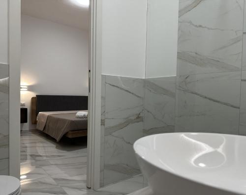 Ένα ή περισσότερα κρεβάτια σε δωμάτιο στο BreMi Rooms B&B