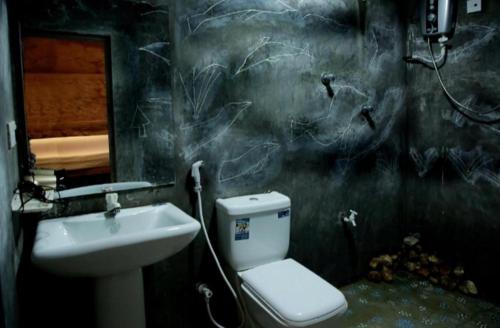 a bathroom with a toilet and a sink at B City Villa Ella in Ella