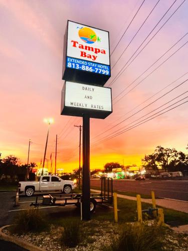 a sign for a tampa bay fast food restaurant at Tampa Bay Extended Stay - Airport in Tampa