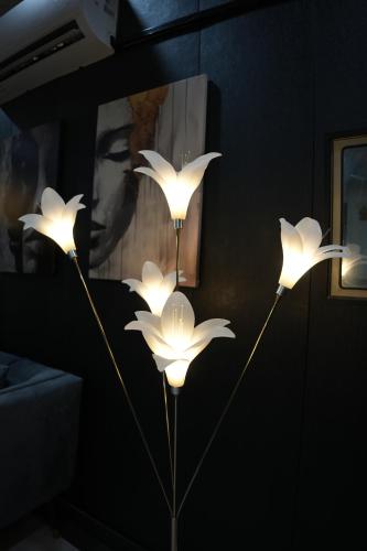 a group of four lights on a wall at Perfect Place for Family in Lahore in Lahore