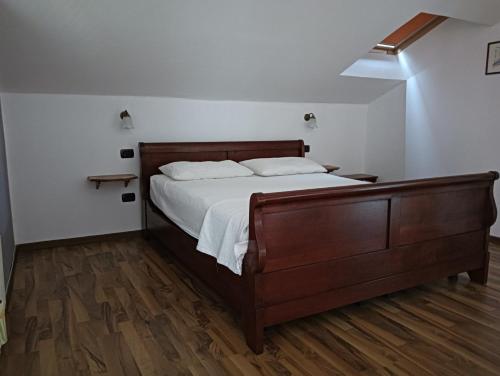 Postel nebo postele na pokoji v ubytování B&B Tre Confini
