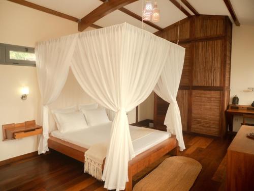 Katil atau katil-katil dalam bilik di La Colombine Appart'Hôtel