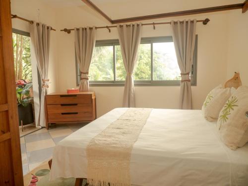 Katil atau katil-katil dalam bilik di La Colombine Appart'Hôtel