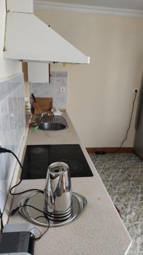 a tea kettle sitting on a counter in a kitchen at Willa Rudno Nad Jeziorem Parter in Rudno