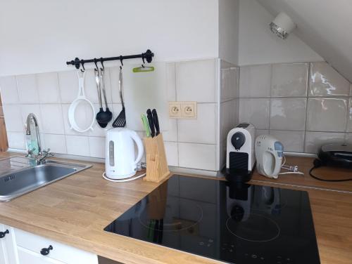 a kitchen with a counter with utensils on it at Ubytovani Ve stodole in Stráž nad Nežárkou