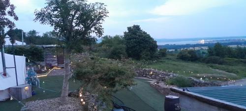 an overhead view of a garden with a stone wall at Fairy Fort at Rosemount Glamping in Carlingford