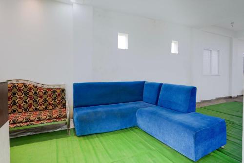 a blue couch and two chairs in a room at HOTEL O SPACE INN Nh 44 in Pānchgaon