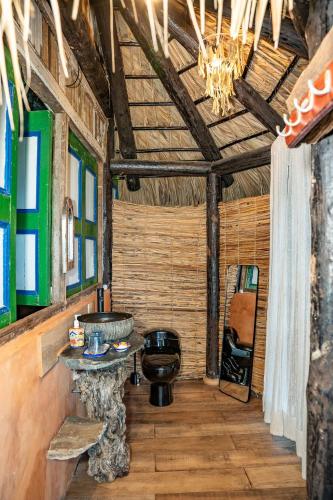 a room with a sink and a table in a room at Casa El Paraiso, Eco Lodge in Santa Bárbara de Samaná